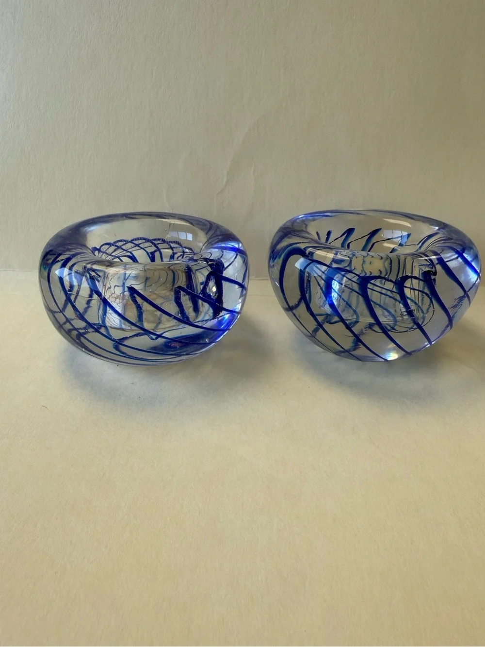 Pair of Handmade Art Glass Paperweight Candle Holders. Clear with Blue Swirl.